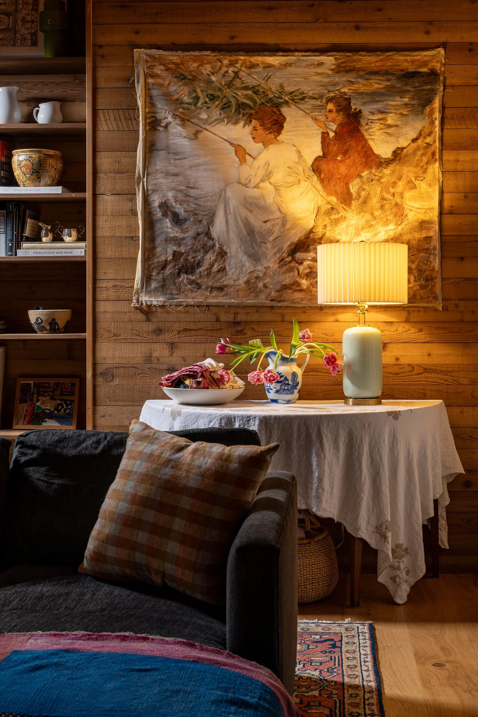 Bainbridge Island interior photography capturing a forest retreat living room nook with wood walls and warm, editorial ambient lighting.