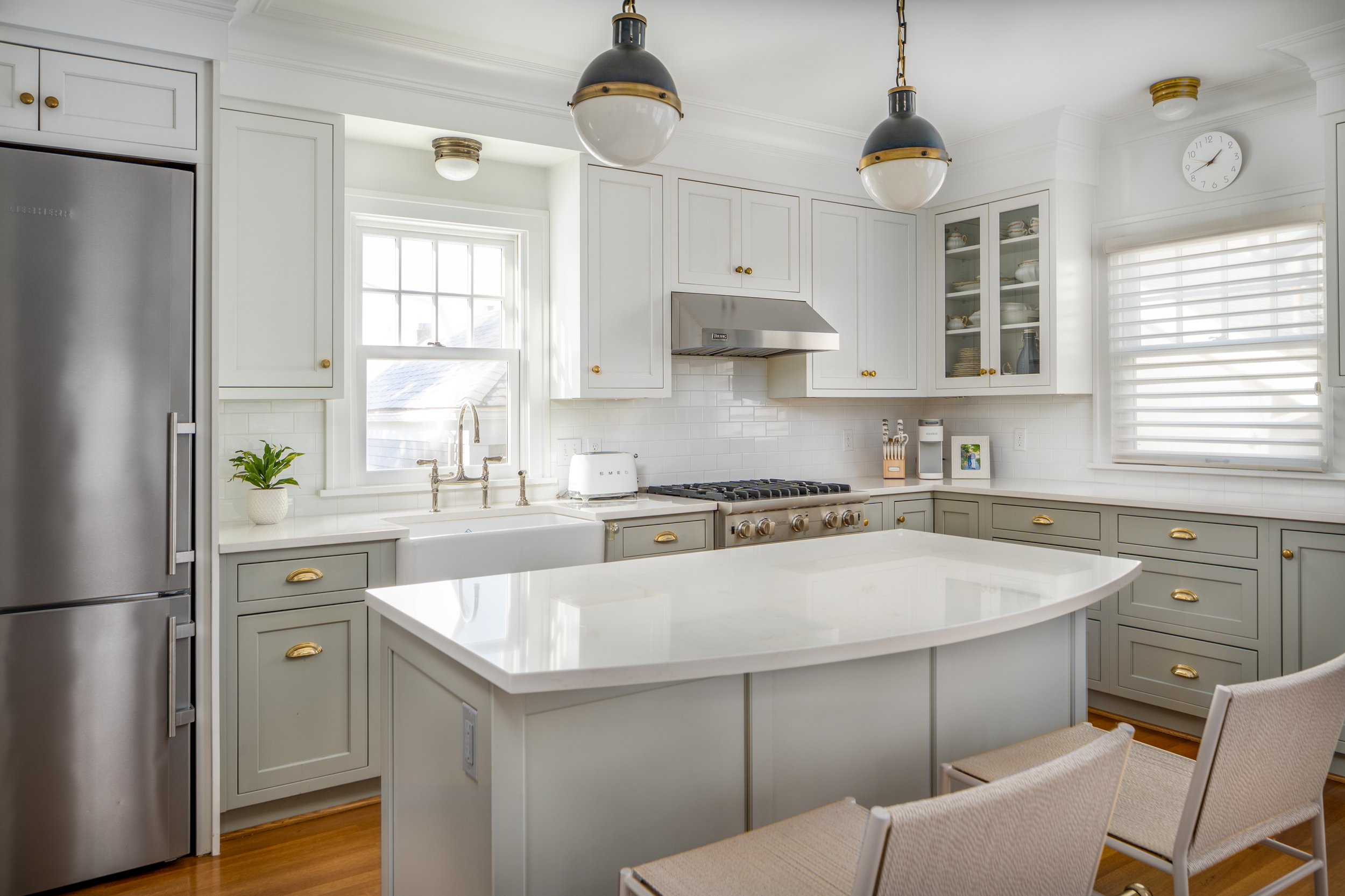 Queen Anne, Seattle | Kitchen Remodel | Light grey cabinets and island with seating