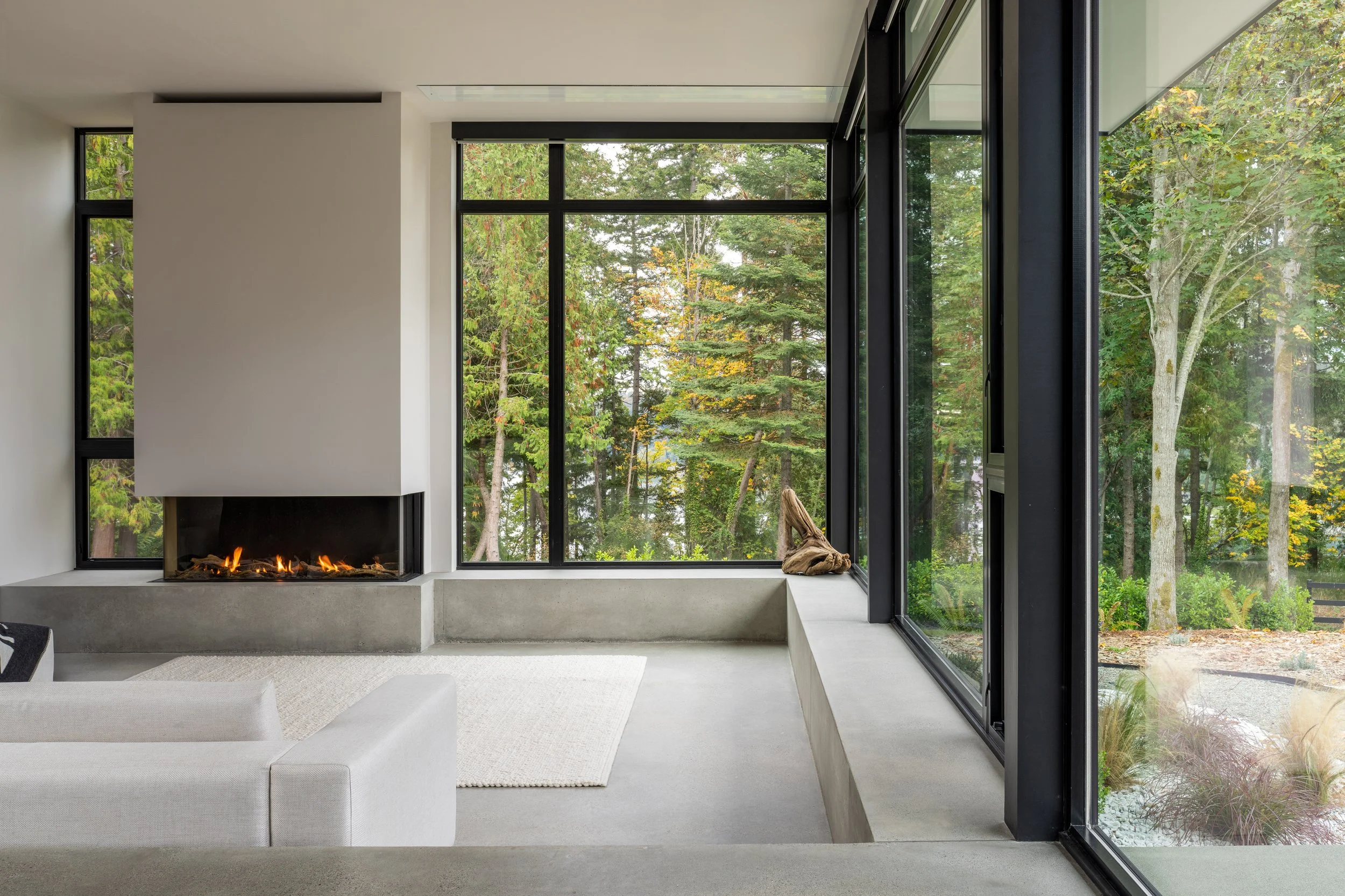 Bainbridge Island, WA | New Construction | Sunken Living Room with glass walls and fireplace