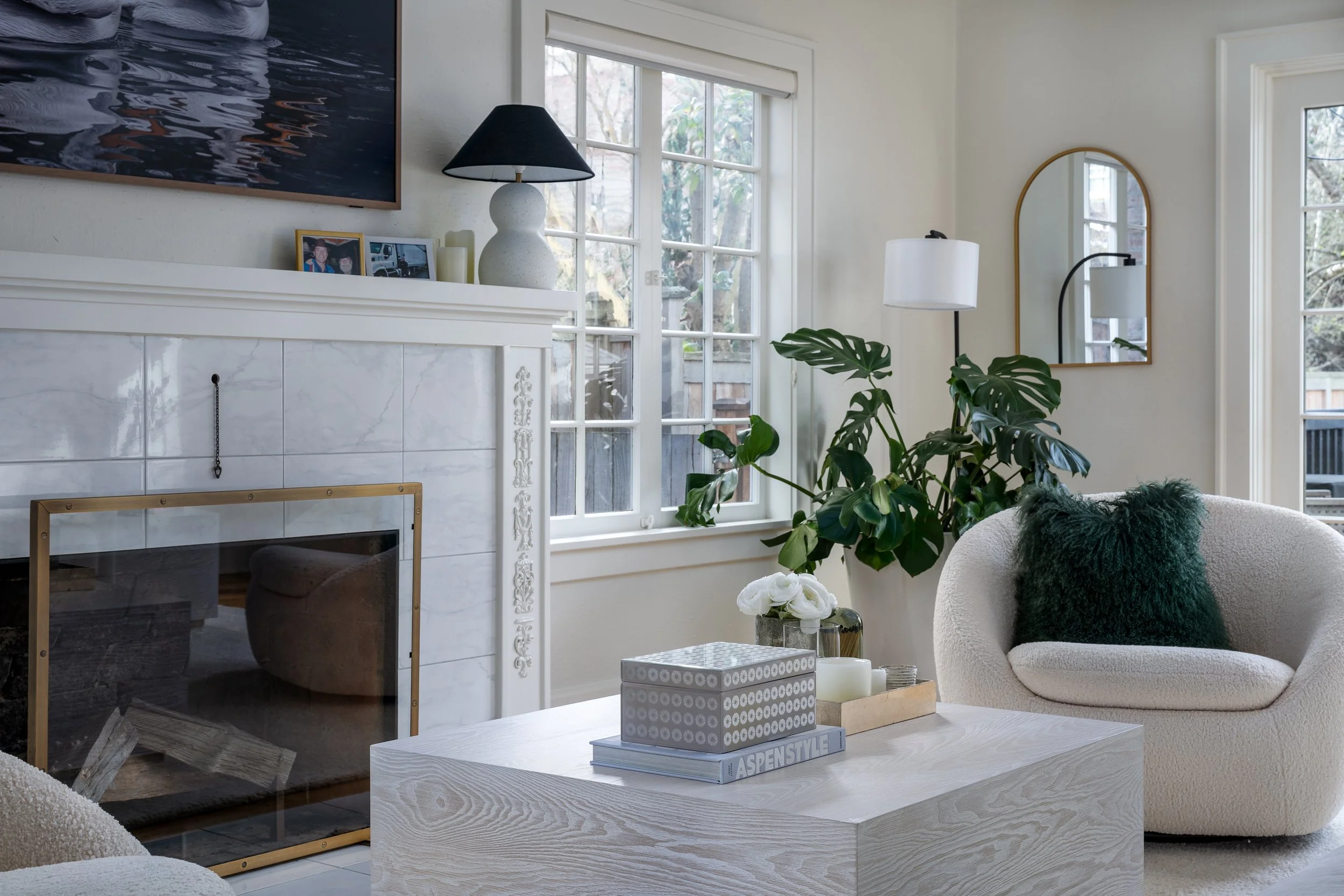 Queen Anne, Seattle | Living Room Remodel | Cream boucle chair and white wood coffee table in front of marble fireplace