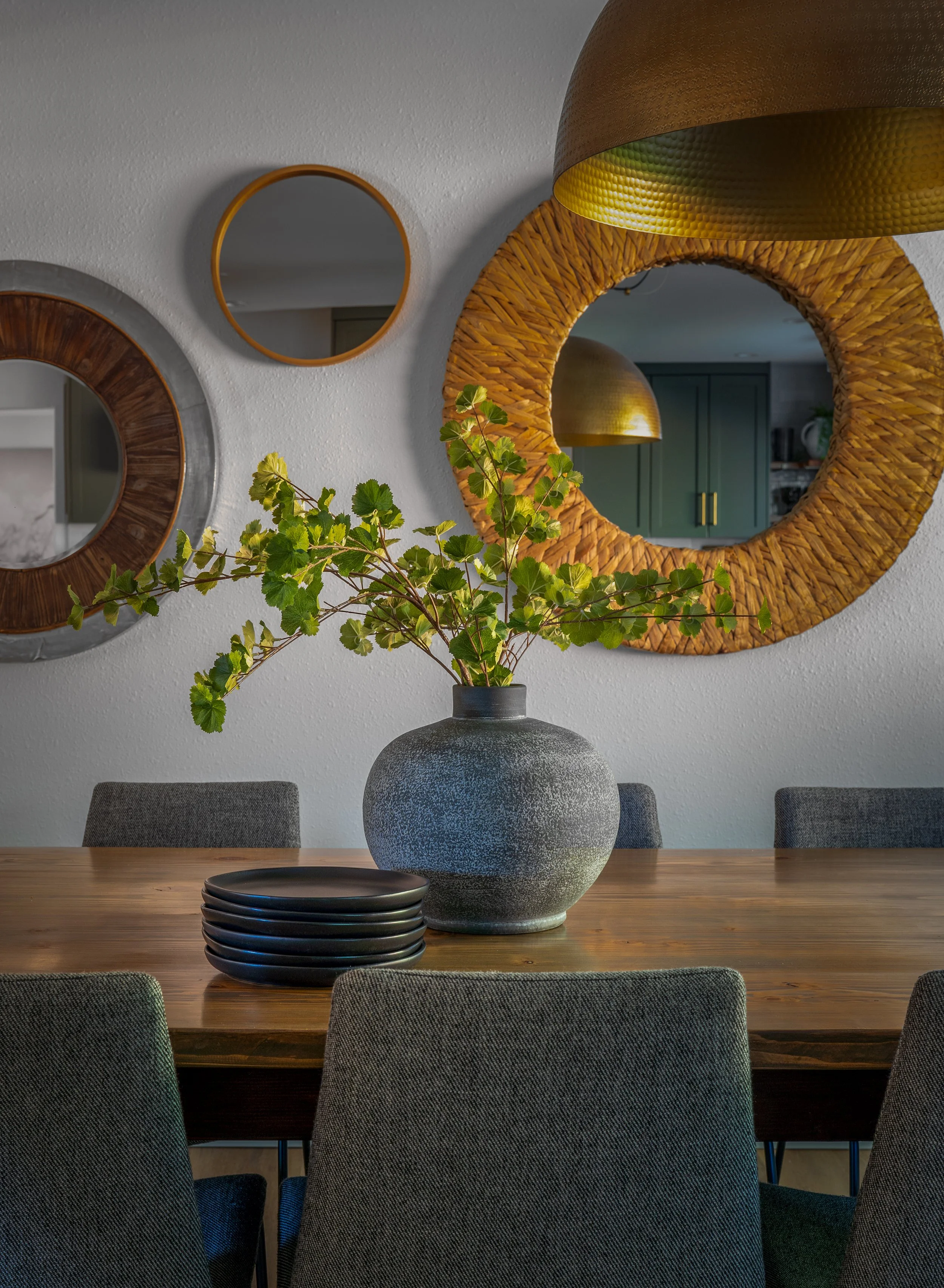 Snohomish, WA | Dining Remodel | Table and chairs in front of gallery wall of mirrors