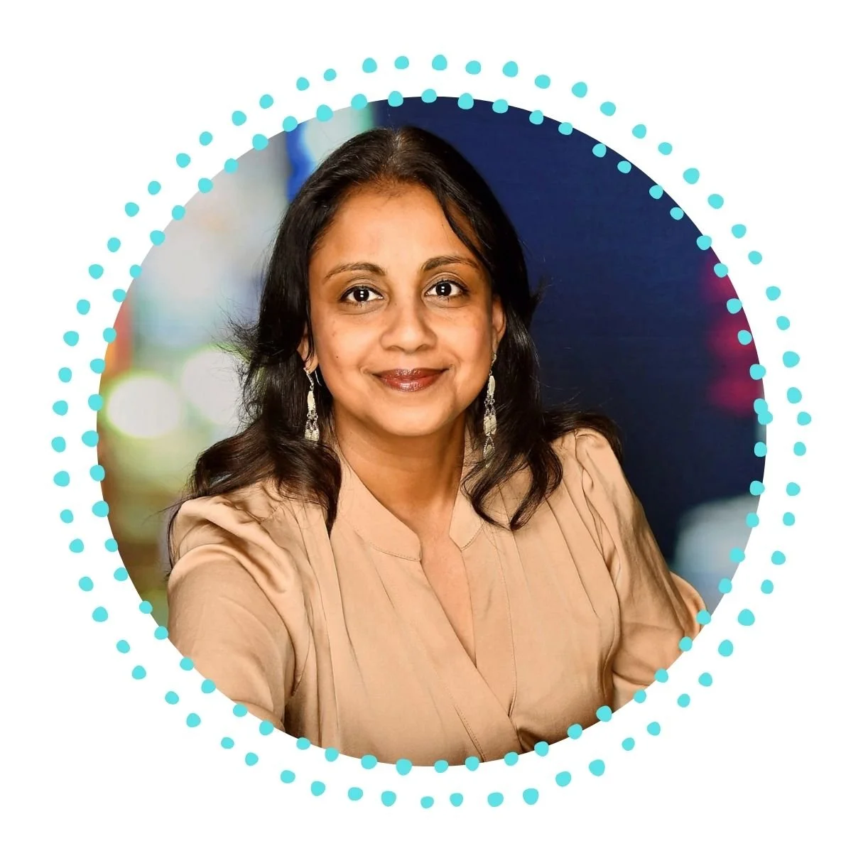 Professional woman with dark hair, wearing earrings and a tan blouse, smiling at the camera, with a blurred colorful background surrounded by a dotted blue circle.