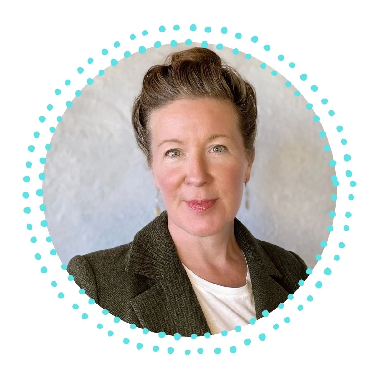 Headshot of a woman with short, styled hair, wearing a blazer over a white top, smiling softly, against a neutral background with decorative dotted circle around.