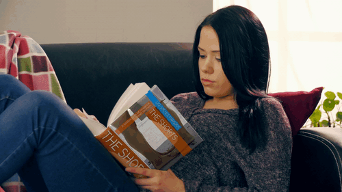 VIDDYOZE-Girl Reading a Book - Close Up.gif