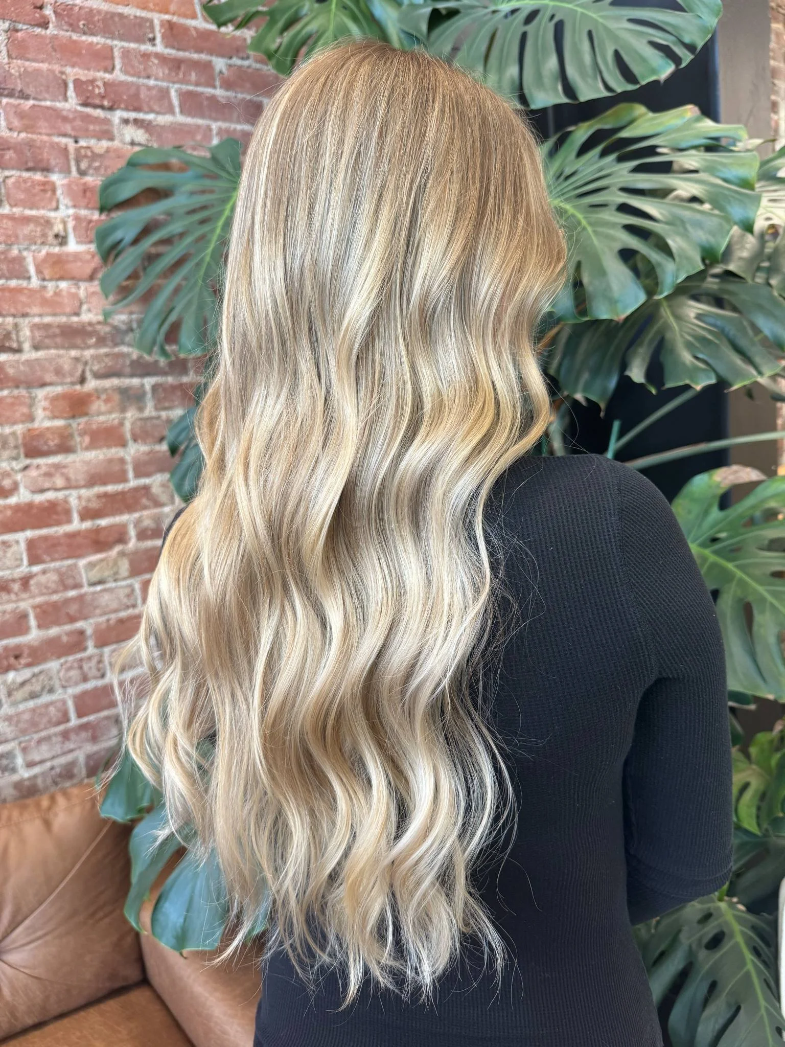Dimensional blonde hair with soft waves by Kaitlyn Coston