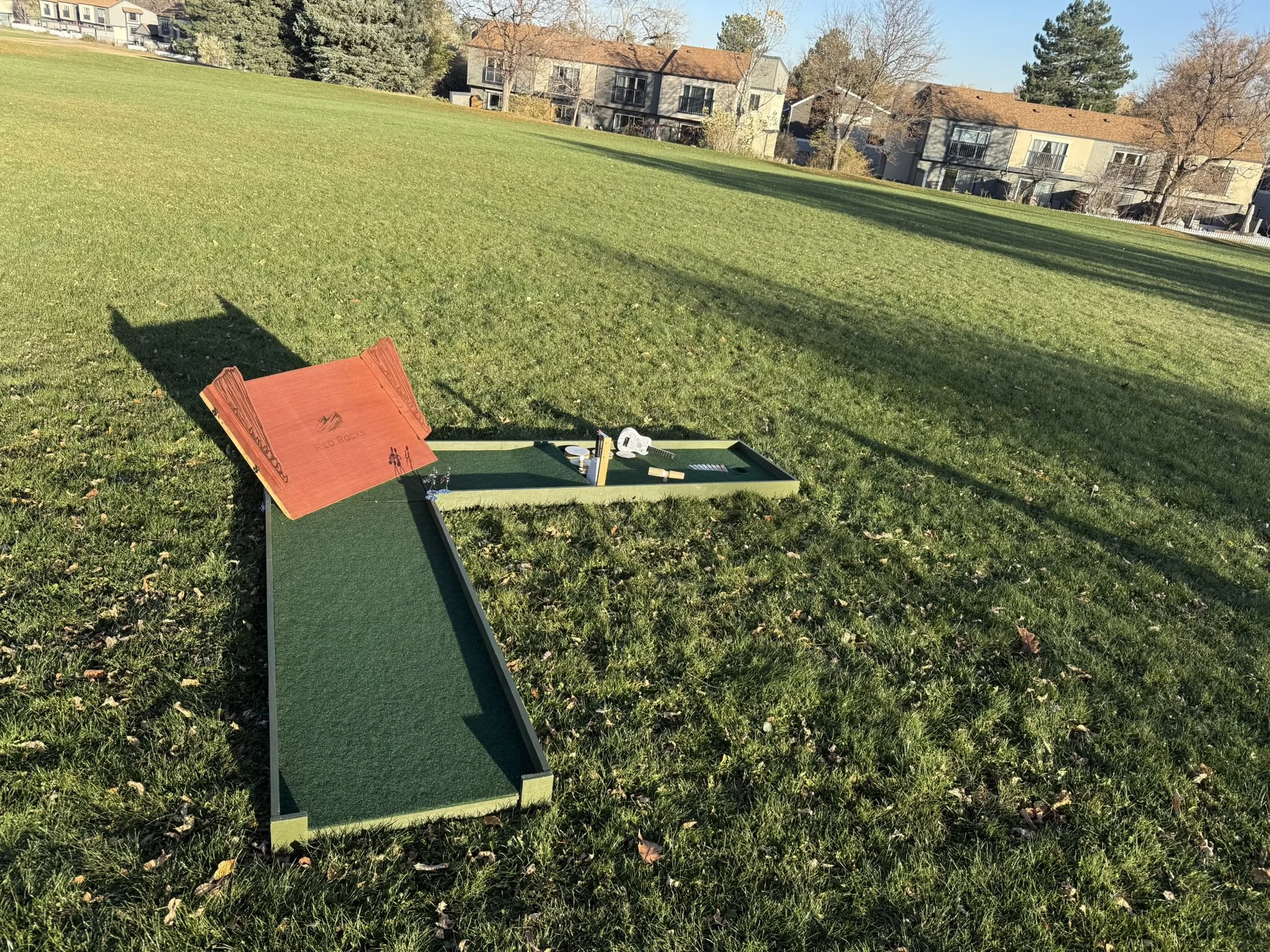 A Red Rocks Amphitheater themed mobile mini golf course with ukulele, drums, cow bell and xylophone.