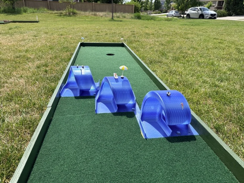 Triple loop themed portable mini golf putt putt rental for events
