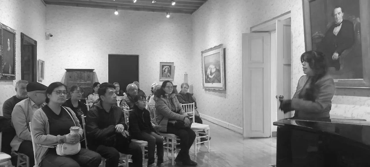 Anna delivering pre-concert conference to make music our universal language.