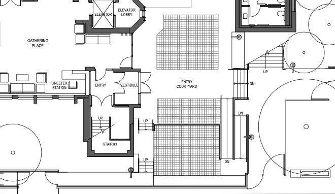 Architectural floor plan of a building's interior layout, showing entry, courtyard, stairs, elevator, gathering place, and various rooms.