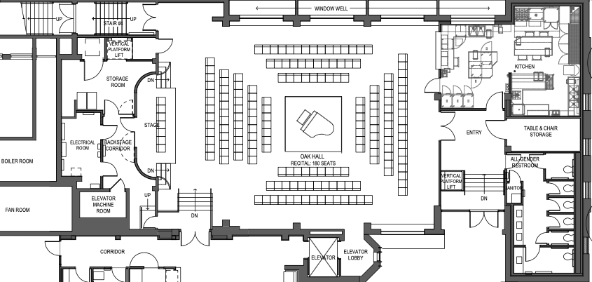 Floor plan of a theater or auditorium with stage, seating area, backstage rooms, kitchen, restrooms, elevator, and storage areas.
