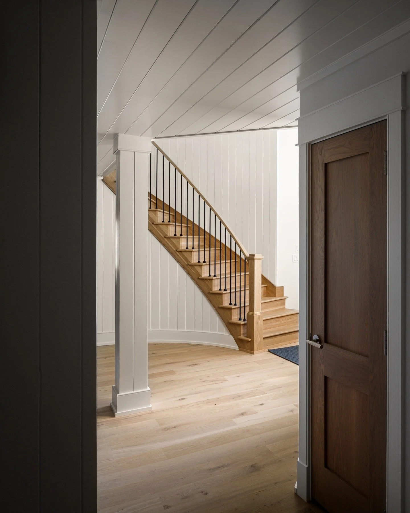 A grand entrance toward a grand staircase 
Builder: @overtoncontractingllc 
Interiors: @oohsaahspc