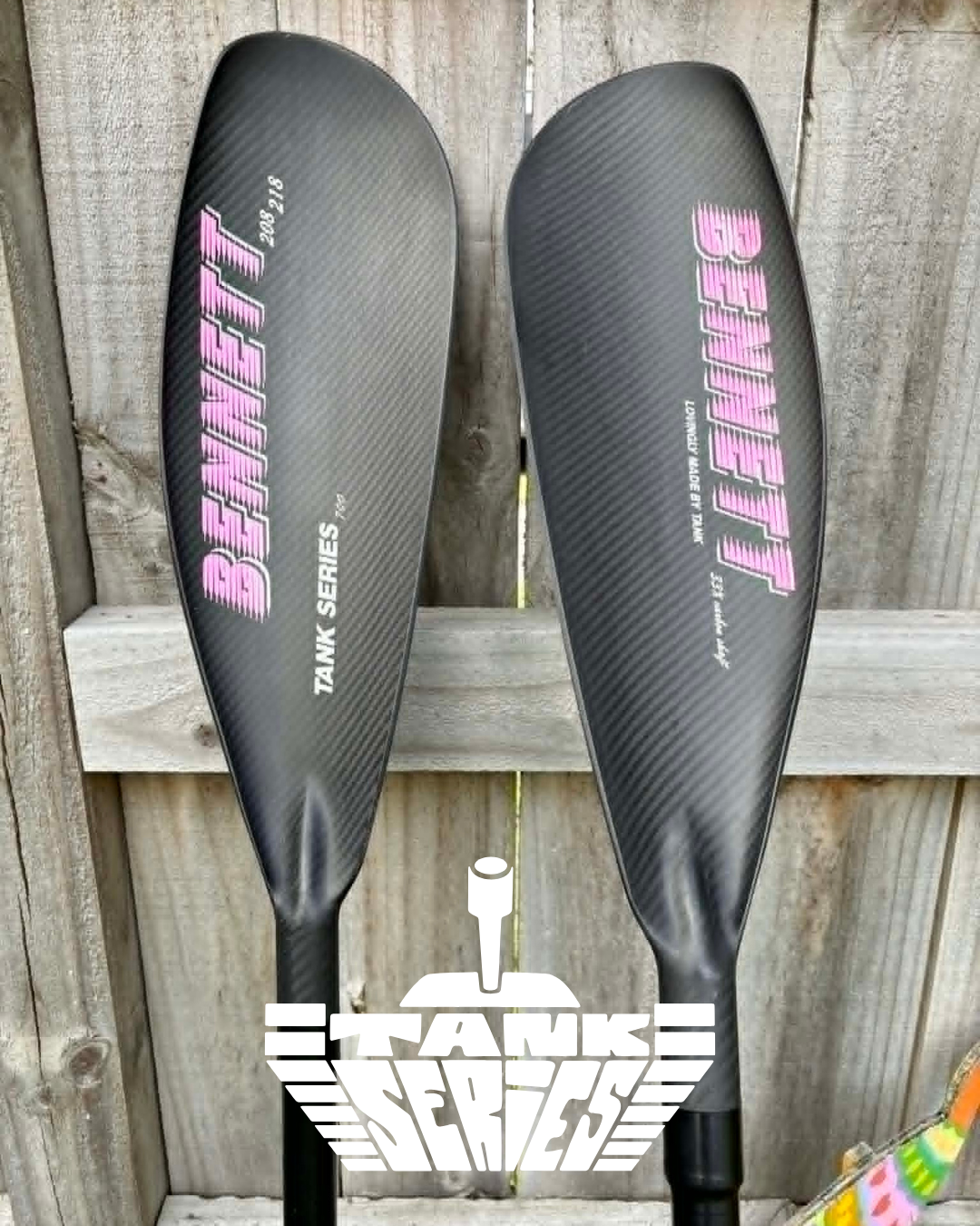 Two black carbon fiber paddles with pink and white Bennett Logo. The new tank series avaliable in NZ