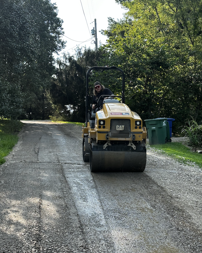 Gravel driveway installation and compaction with roller equipment by Hazy River Earthworks