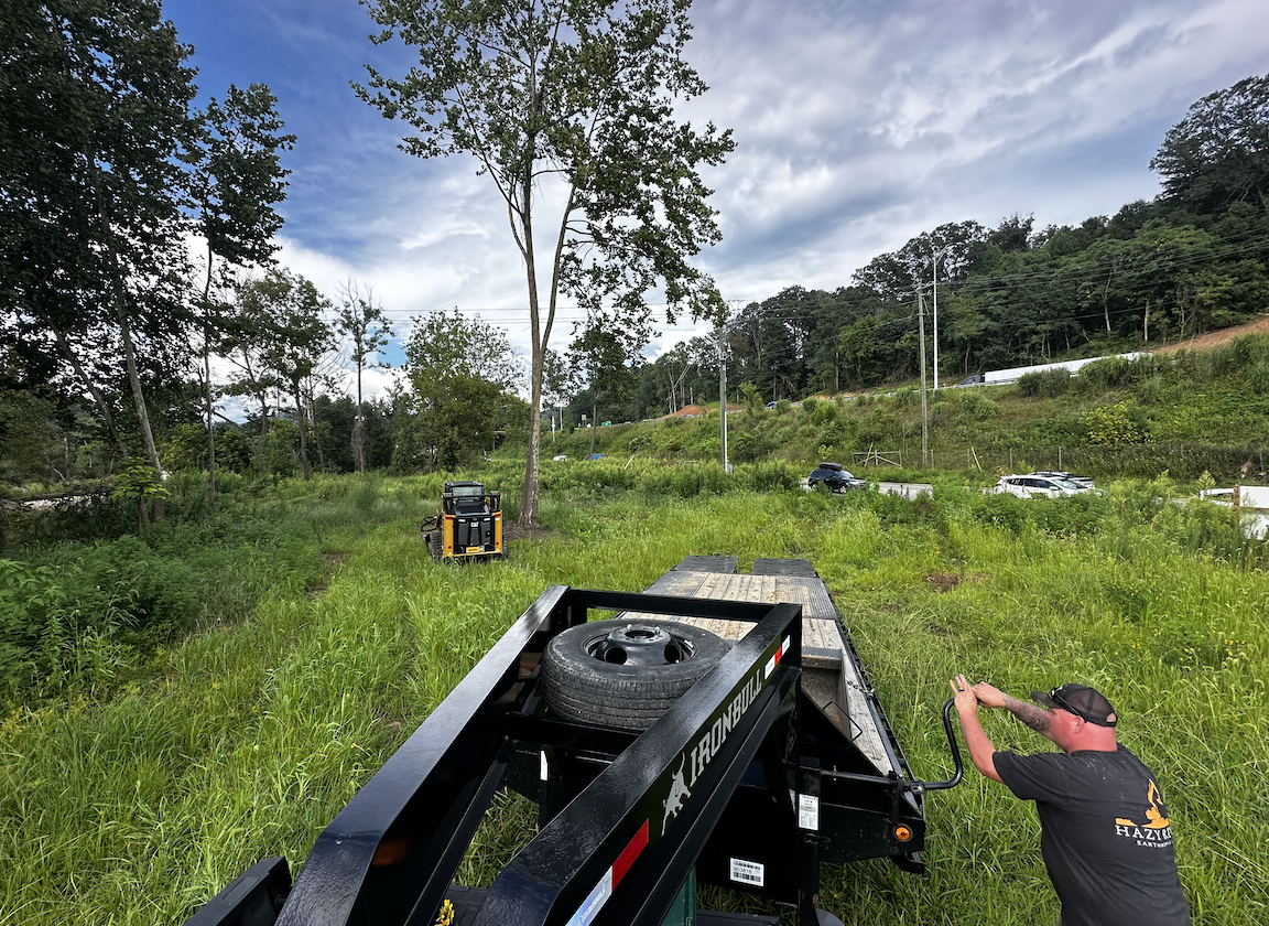 Hazy River Earthworks equipment performing land clearing and site preparation on a large property