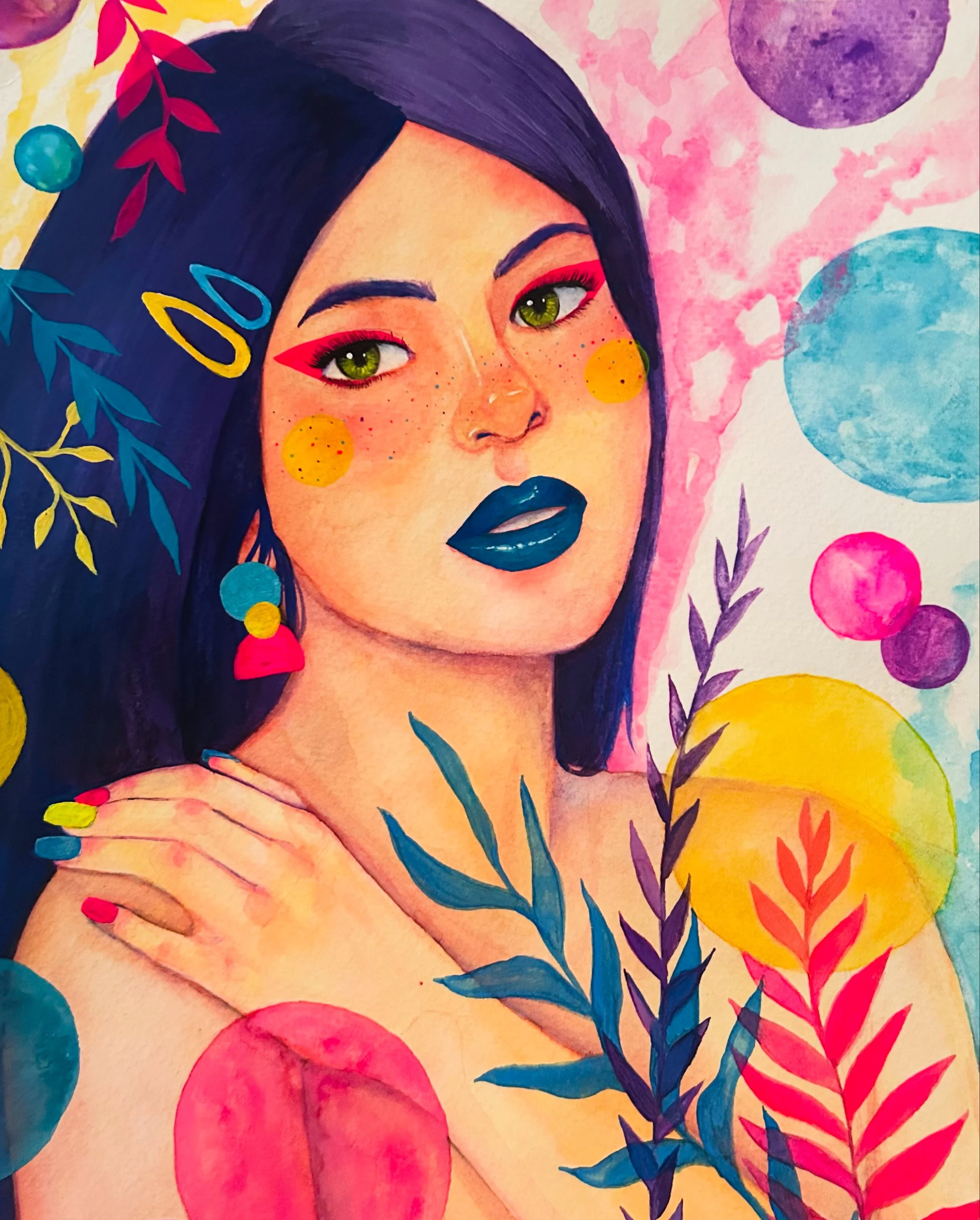 Colorful portrait of a woman with dark hair, green eyes, blue lipstick, pink eye makeup, and colorful freckles, surrounded by vibrant abstract shapes and foliage.