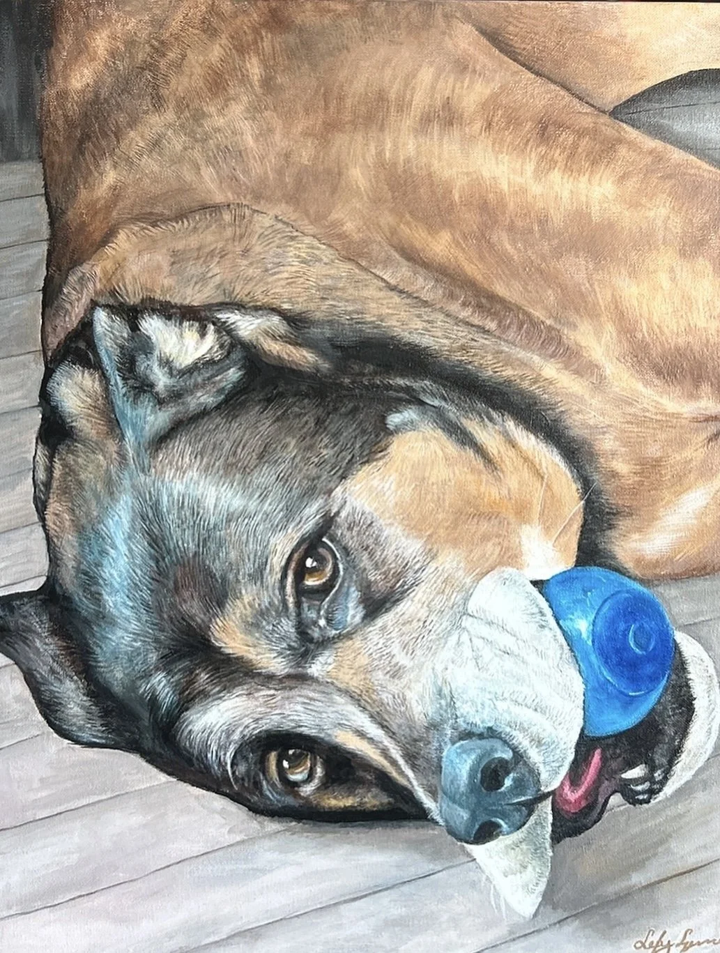 Painting of a dog with a blue ball in its mouth, lying on a wooden floor.