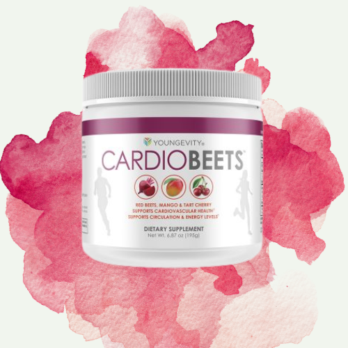 Container of Youngevity CardioBeets dietary supplement with red beets, mango, and tart cherry ingredients, set against a pink and red watercolor background.