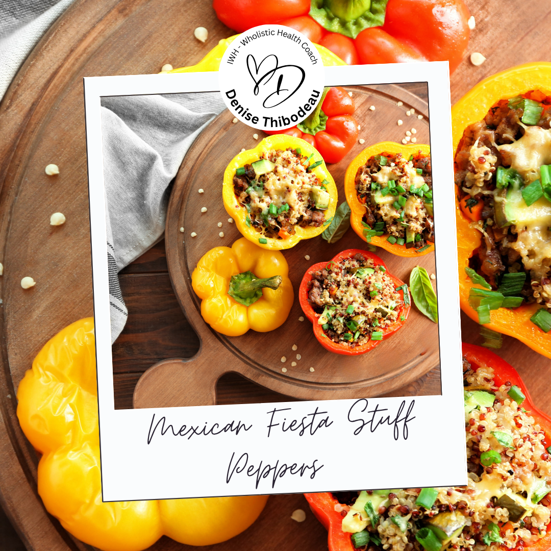 Colorful stuffed bell peppers with quinoa, beef, and vegetables on a wooden cutting board, with additional peppers in the background.