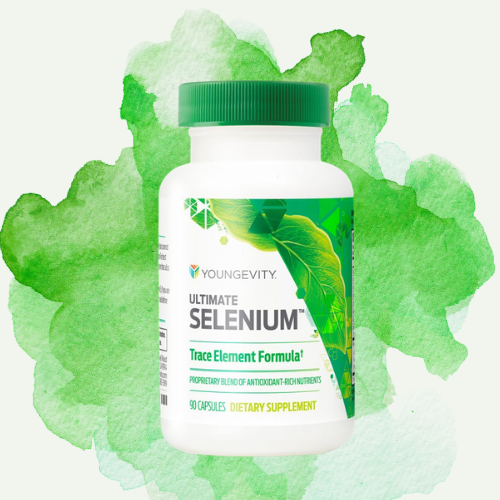 A bottle of Youngevity Ultimate Selenium dietary supplement with a green cap and label featuring green leaves, set against a watercolor green background.