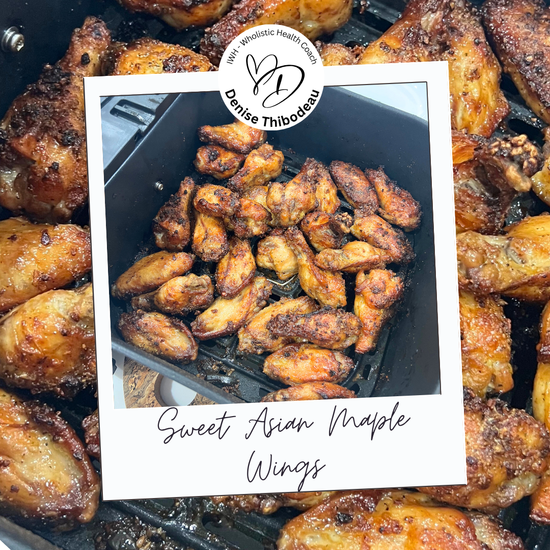 A close-up view of cooked sweet Asian maple wings with a golden-brown and slightly crispy exterior, surrounded by other cooked chicken wings in the background.