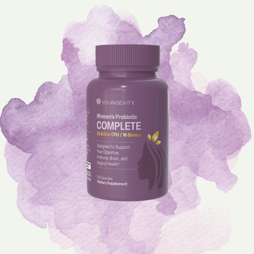 A bottle of Youngevity Women's Probiotic Complete with 16 strains of probiotics, placed against a purple watercolor background.