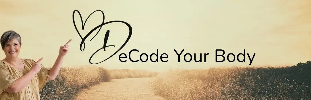 A smiling woman pointing towards the text 'DeCode Your Body' with a landscape background of a dirt path and fields, and a heart-shaped outline around the letter 'D'.