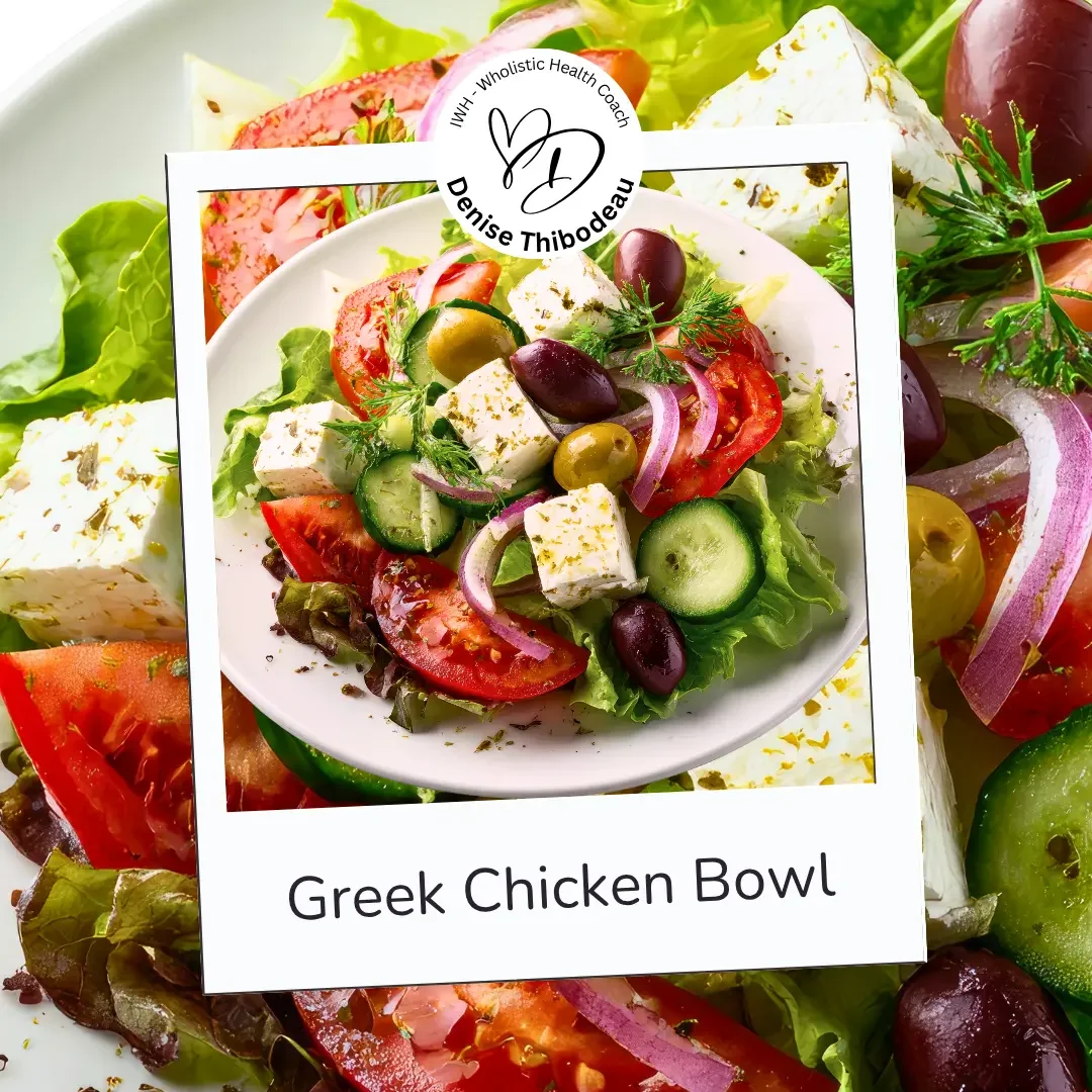 A Greek chicken salad in a white bowl on a bed of mixed greens, topped with cucumbers, tomatoes, red onions, olives, feta cheese, and herbs, with a label reading "Greek Chicken Bowl" and a logo for Denise Thibodeau.