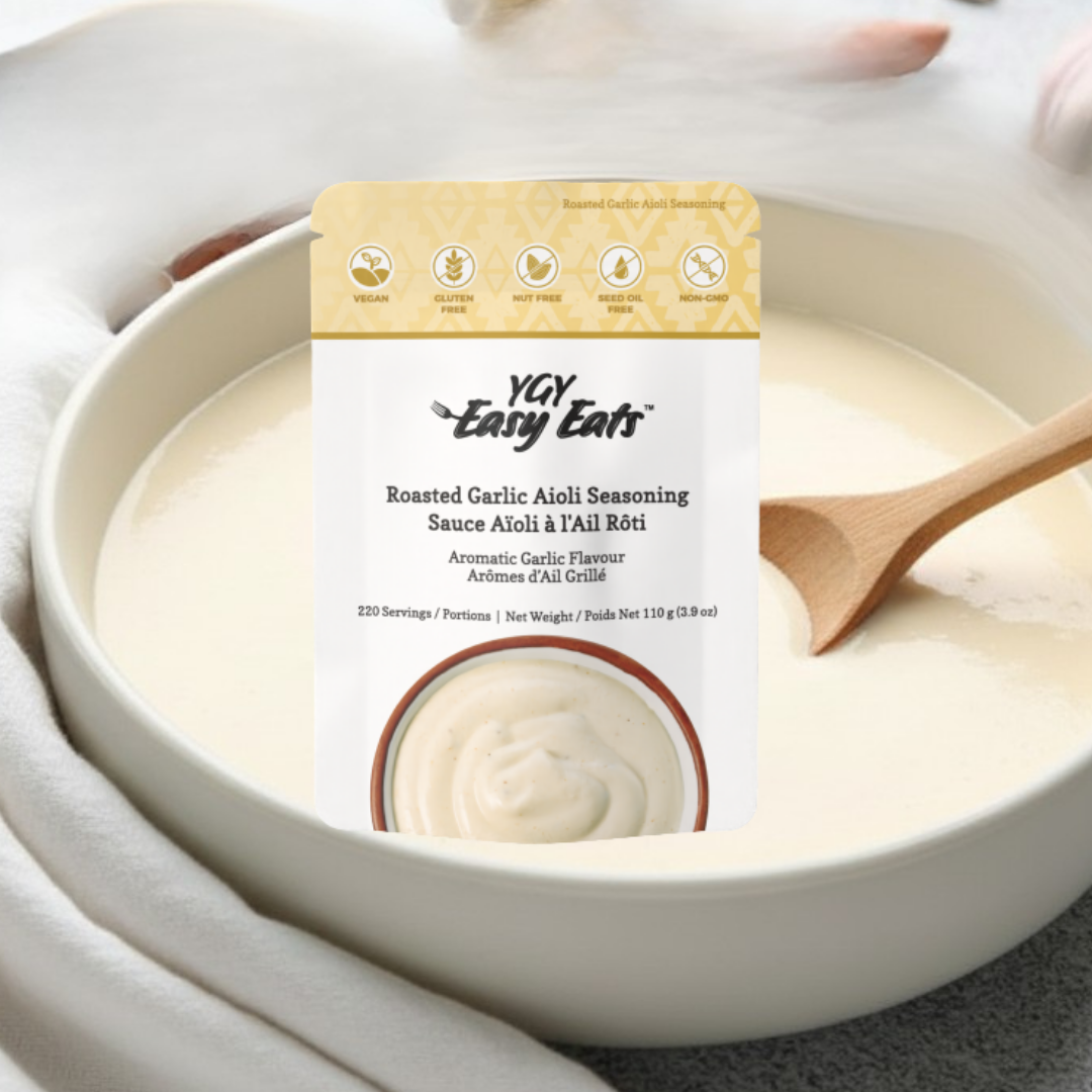 Package of YGY Tasty Ears Roasted Garlic Aioli Seasoning in a white bowl with a wooden spoon.