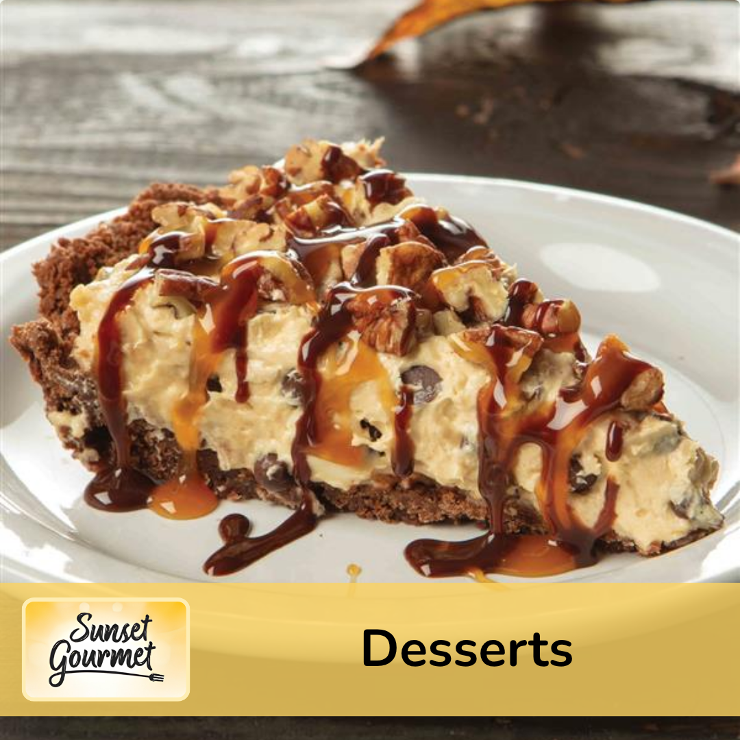 A slice of cheesecake topped with chopped nuts and drizzled with caramel and chocolate sauces, placed on a white plate.