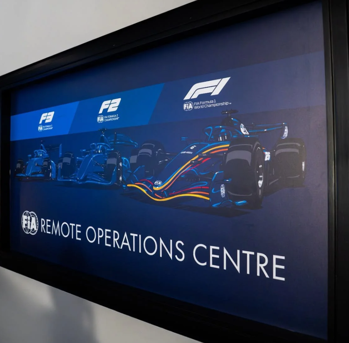 Framed FIA Remote Operations Centre artwork showing Formula 3, Formula 2 and Formula 1 cars