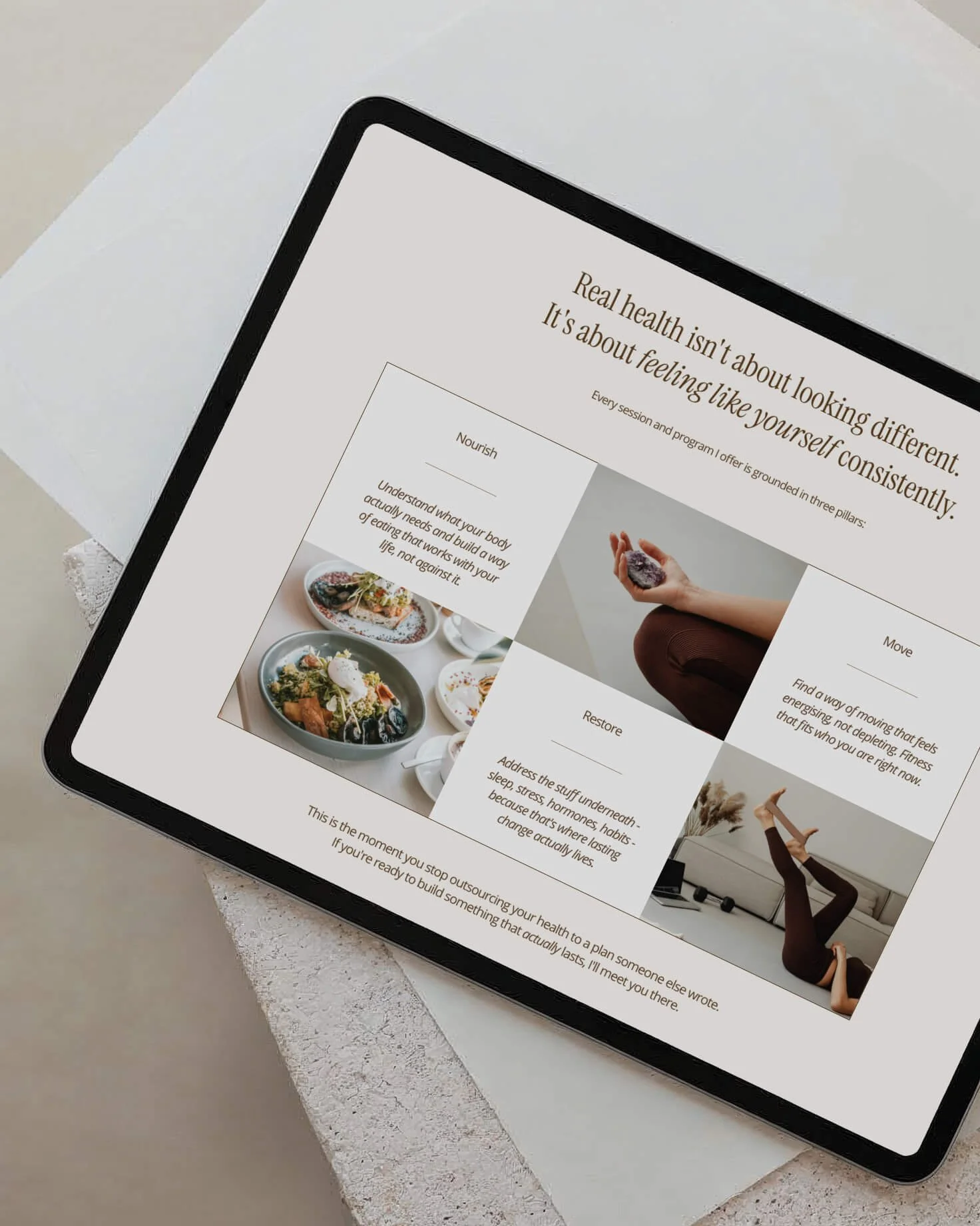 A tablet displaying a health-related article with images of healthy food and a person practicing yoga, placed on a white surface.