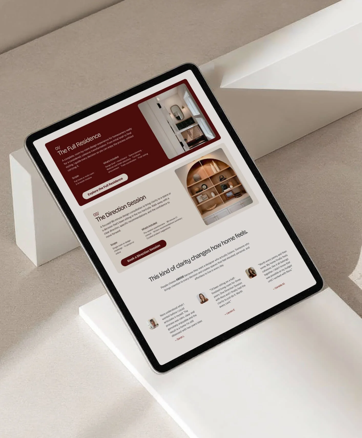 A tablet displaying a real estate website or brochure, placed on a white pedestal against a neutral background.