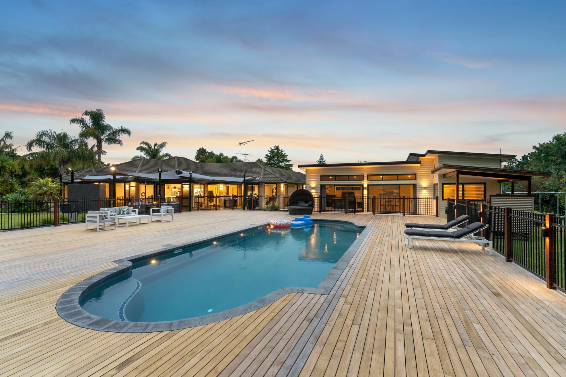 MK Pools Classic fibreglass pool with curved edges and tiled steps — timeless family pool design built for relaxation and summer fun in New Zealand.