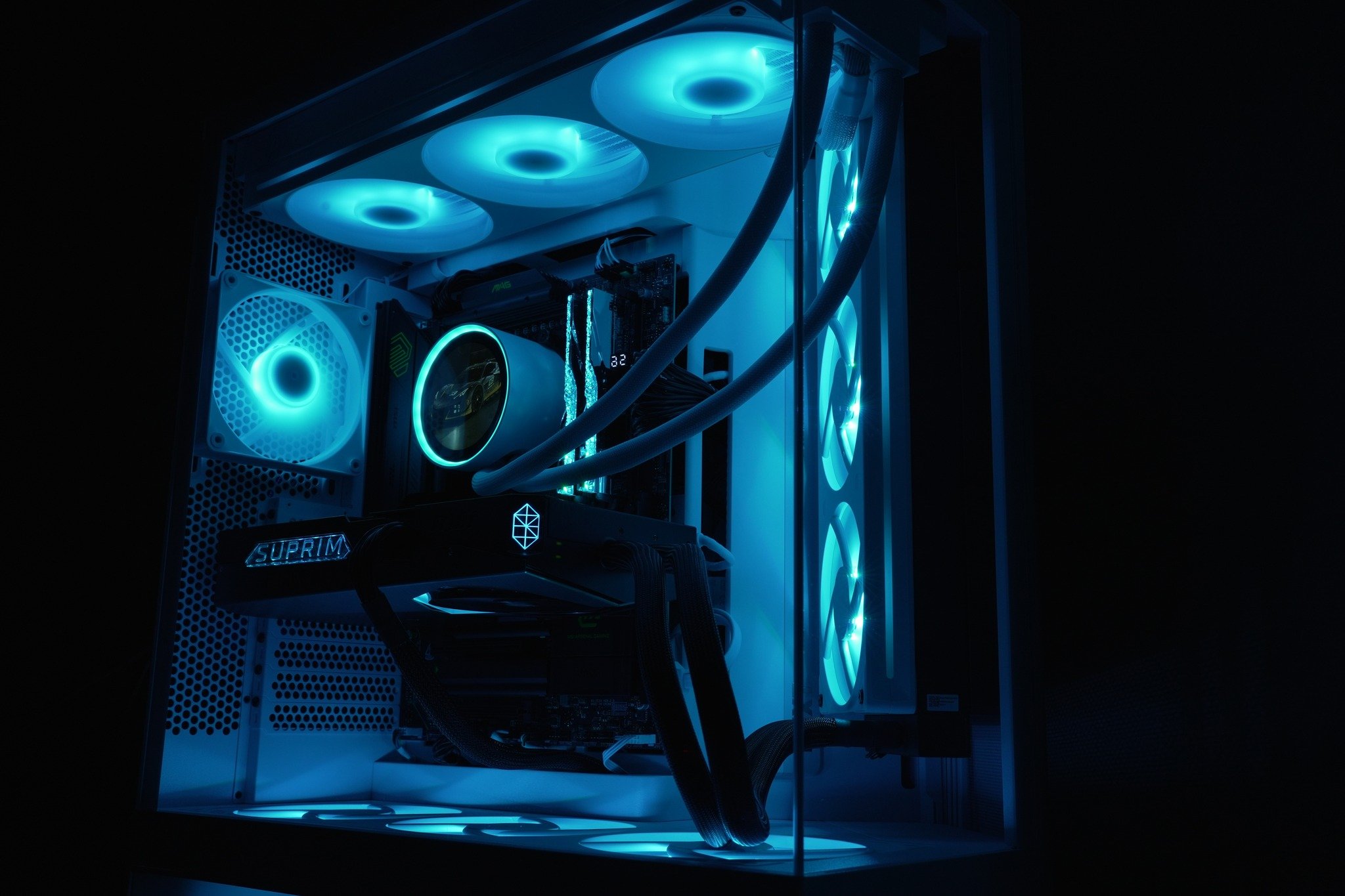 DLB Precision sim racing PC illuminated in blue and purple