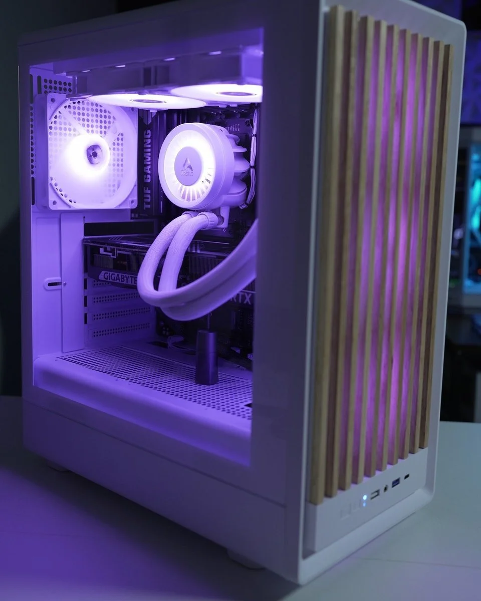 White custom gaming PC built by DLB Precision with purple lighting and a wood-slat front