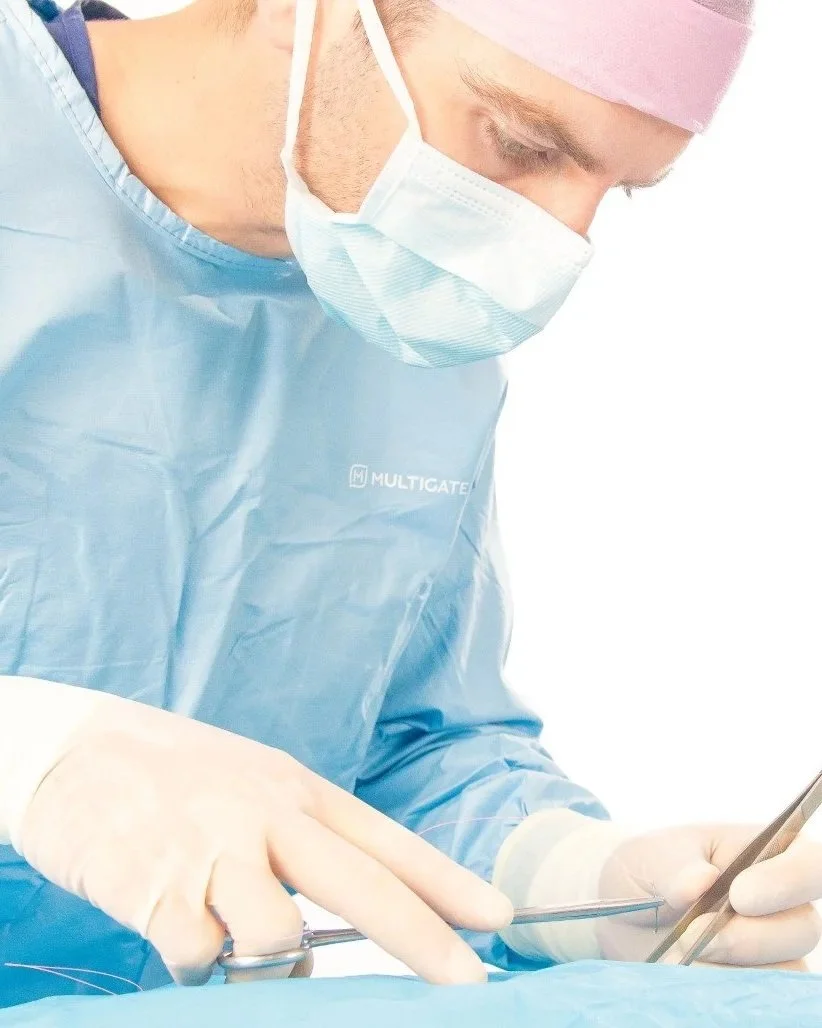 Matthew Robinson performing veterinary surgery.