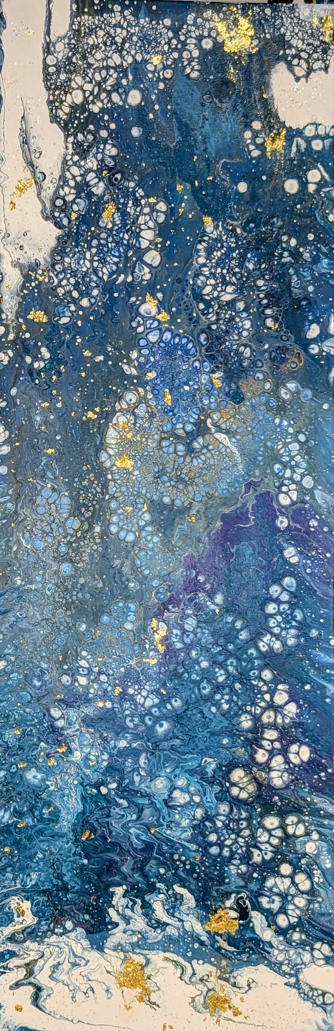 Abstract painting with swirling blue, white, purple, and gray colors, accented with gold flecks scattered throughout.