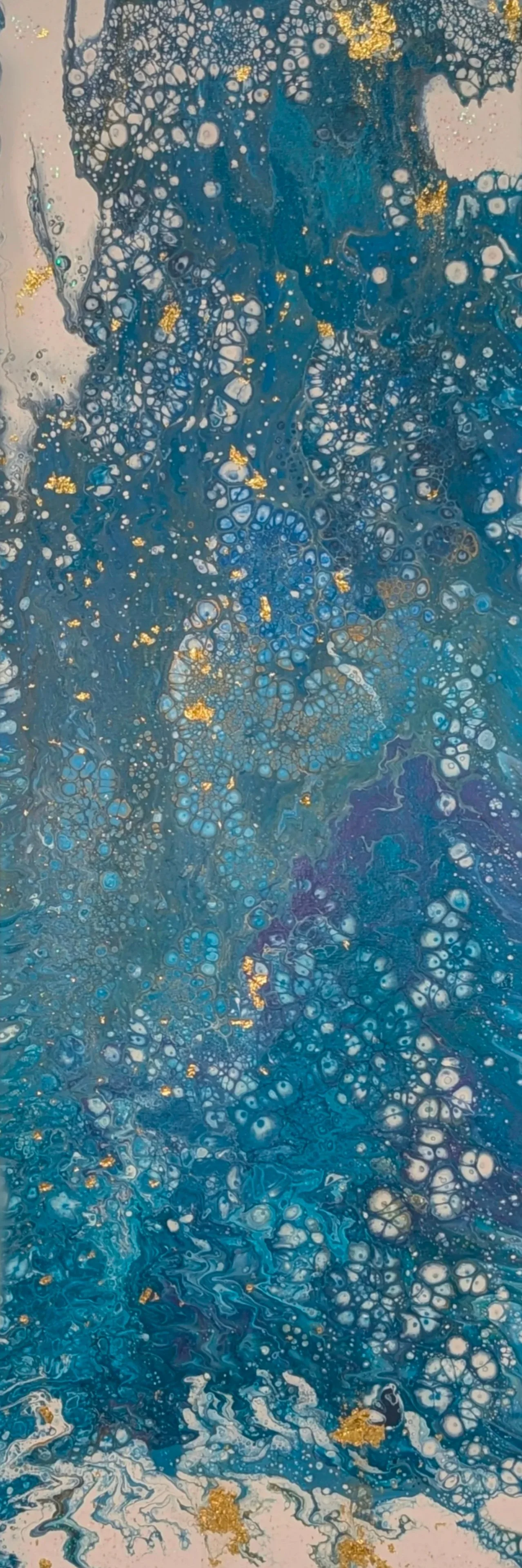 Abstract artwork with swirling patterns of blue, white, and gold, resembling marbled paper or fluid acrylic paint.