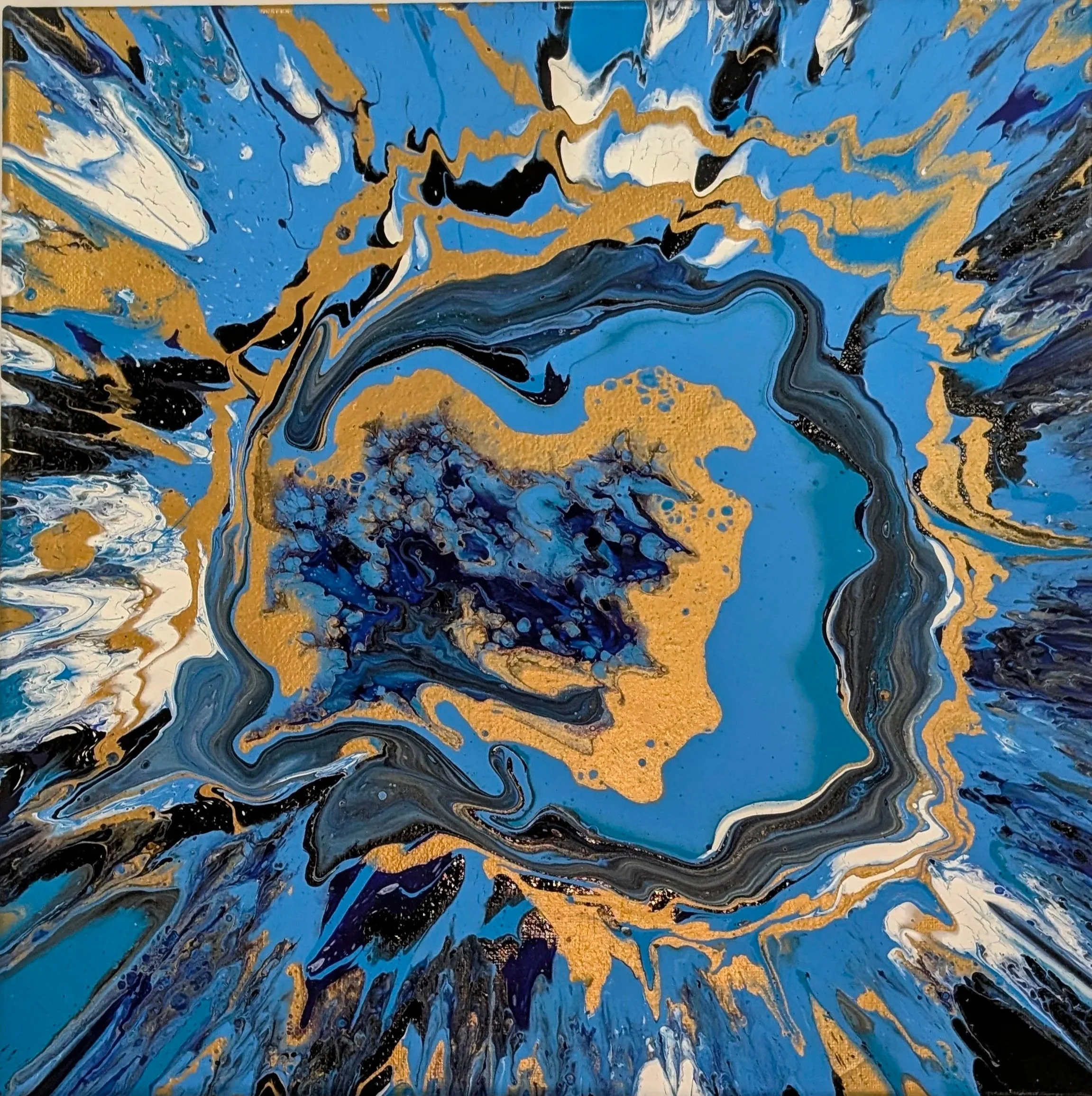 Abstract painting with swirls of blue, black, white, and gold colors.