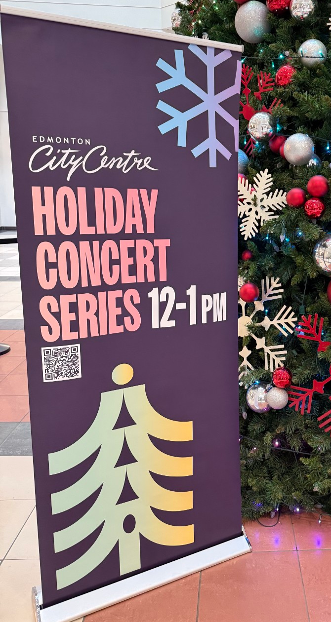 Pull up banner for Edmonton City Center advertising a Christmas choir event