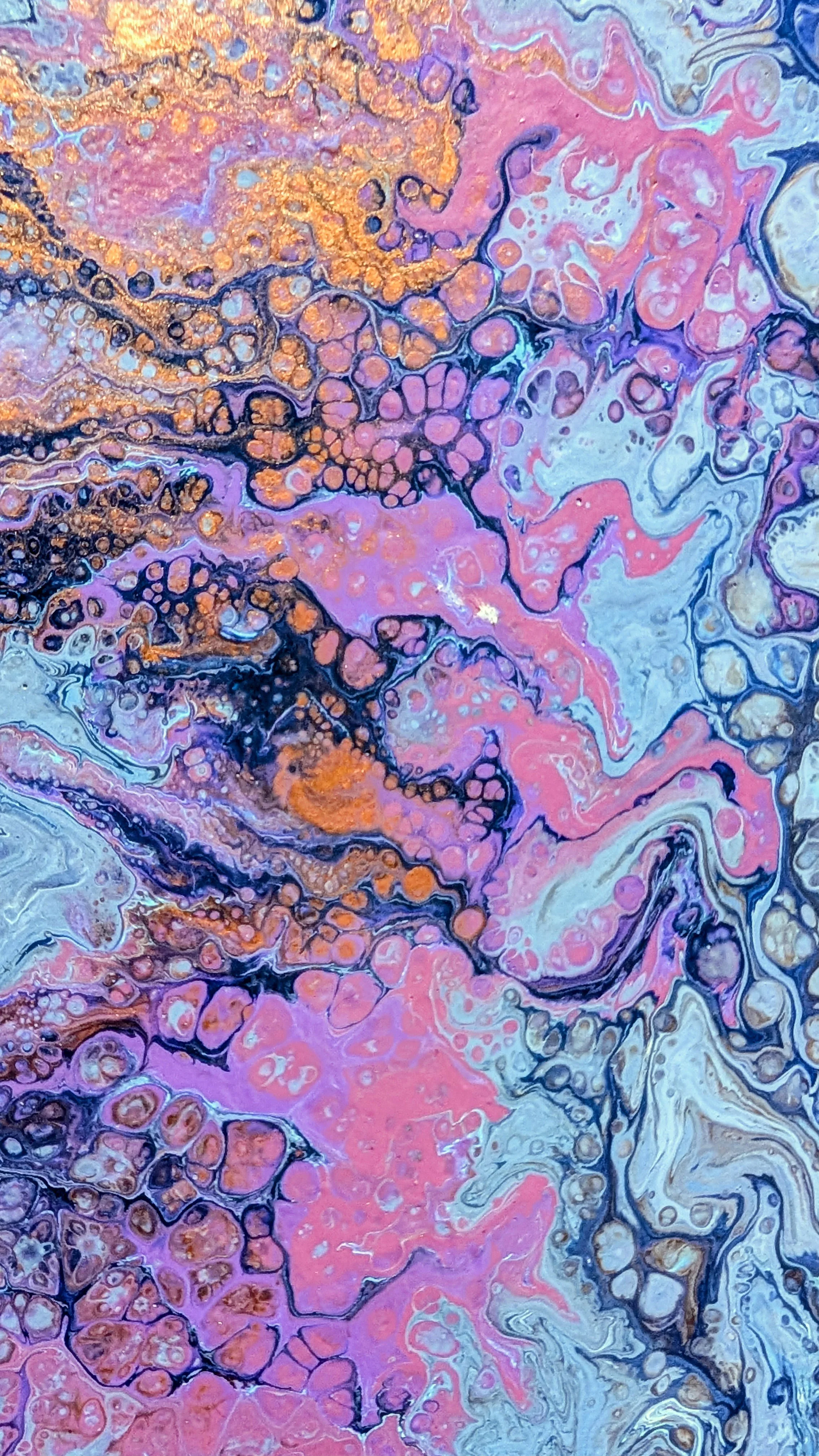 Abstract fluid art painting with vibrant pink, purple, blue, and orange colors swirling and blending together, creating bubble-like and marbled patterns.