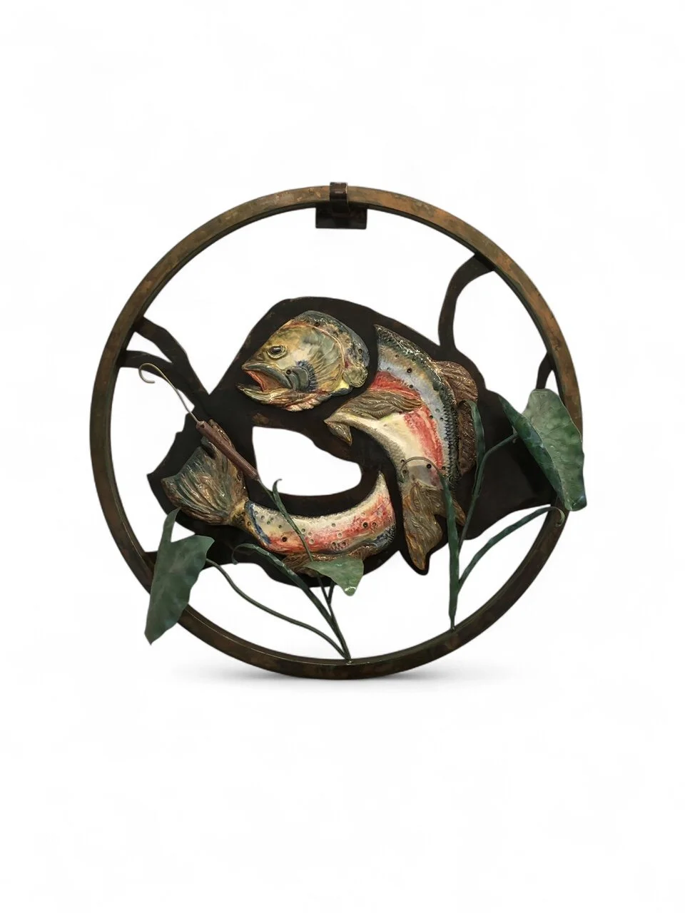 mixed material metal and ceramic fish in a metal circle