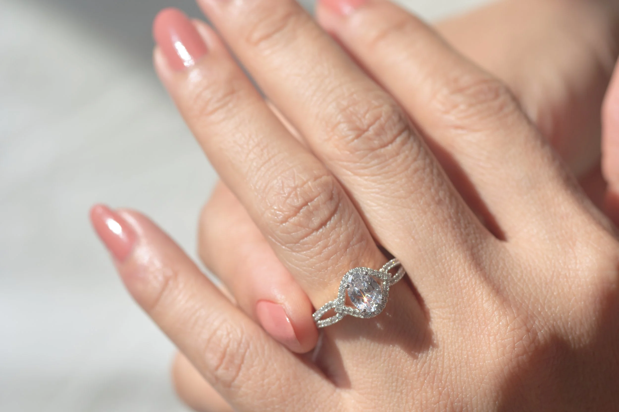 close-up-view-of-diamond-ring-and-woman-hand-2025-03-12-21-53-15-utc.jpg