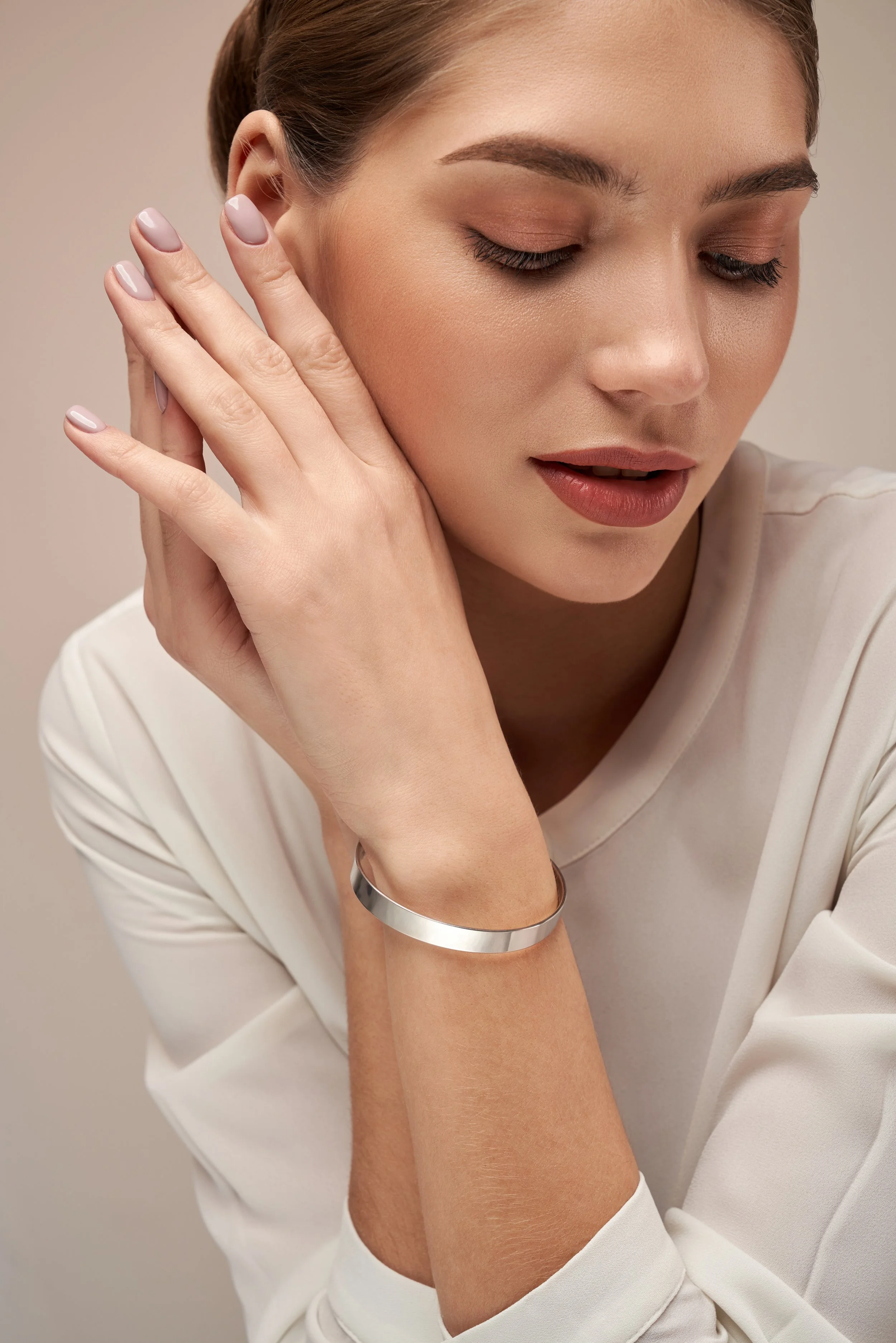 young-brunette-model-demonstrating-bracelet-2025-03-24-12-46-35-utc.JPG