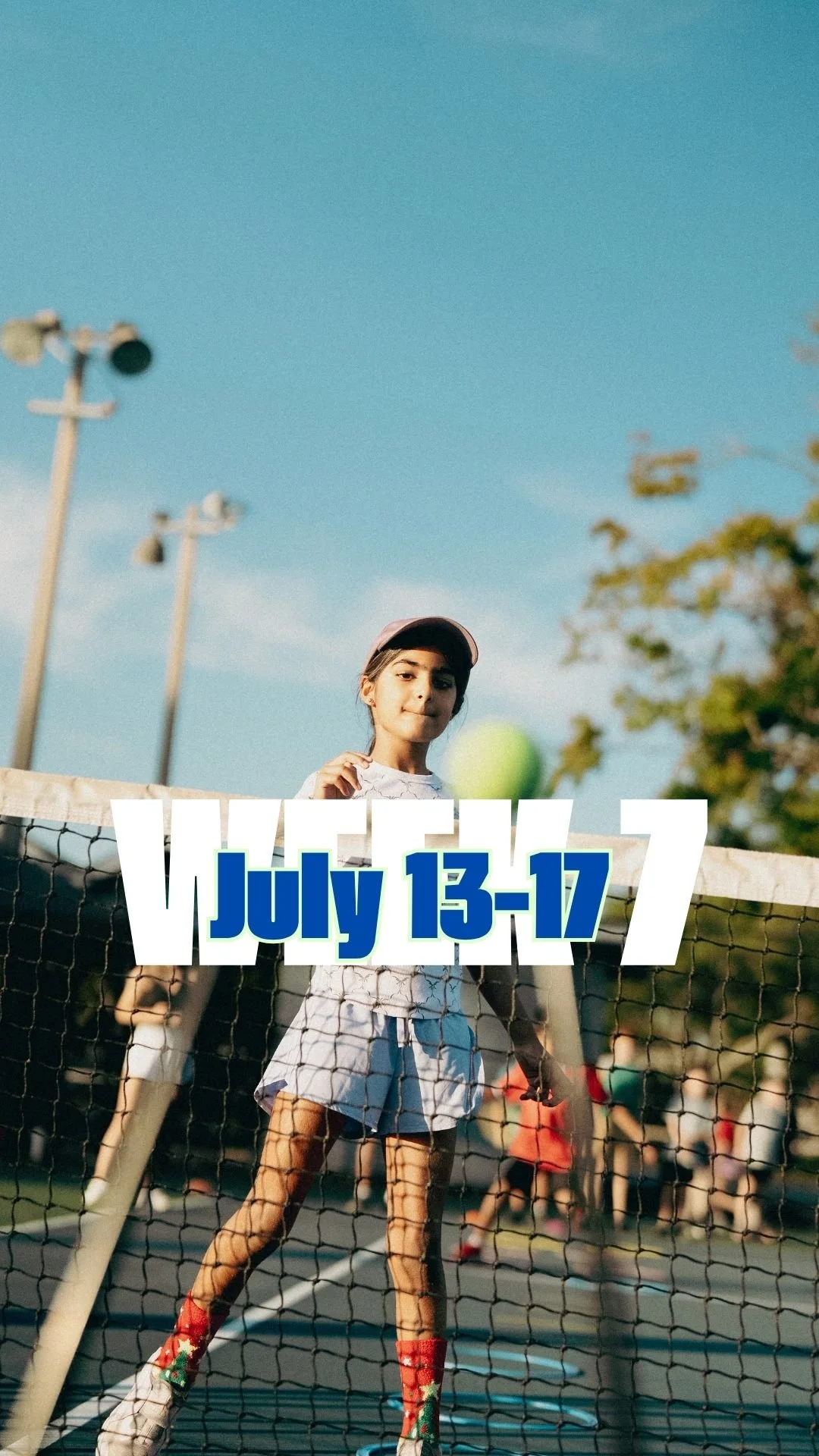 A young girl playing tennis outdoors on a sunny day with a banner displaying 'July 13-17' over her.