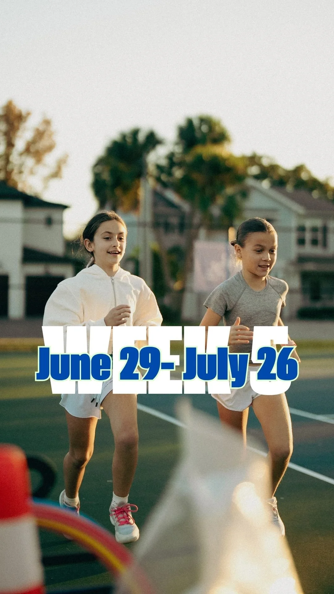 Two young girls running on a track outdoors during daylight, with trees and houses in the background, overlaid with text 'June 29 - July 26'.