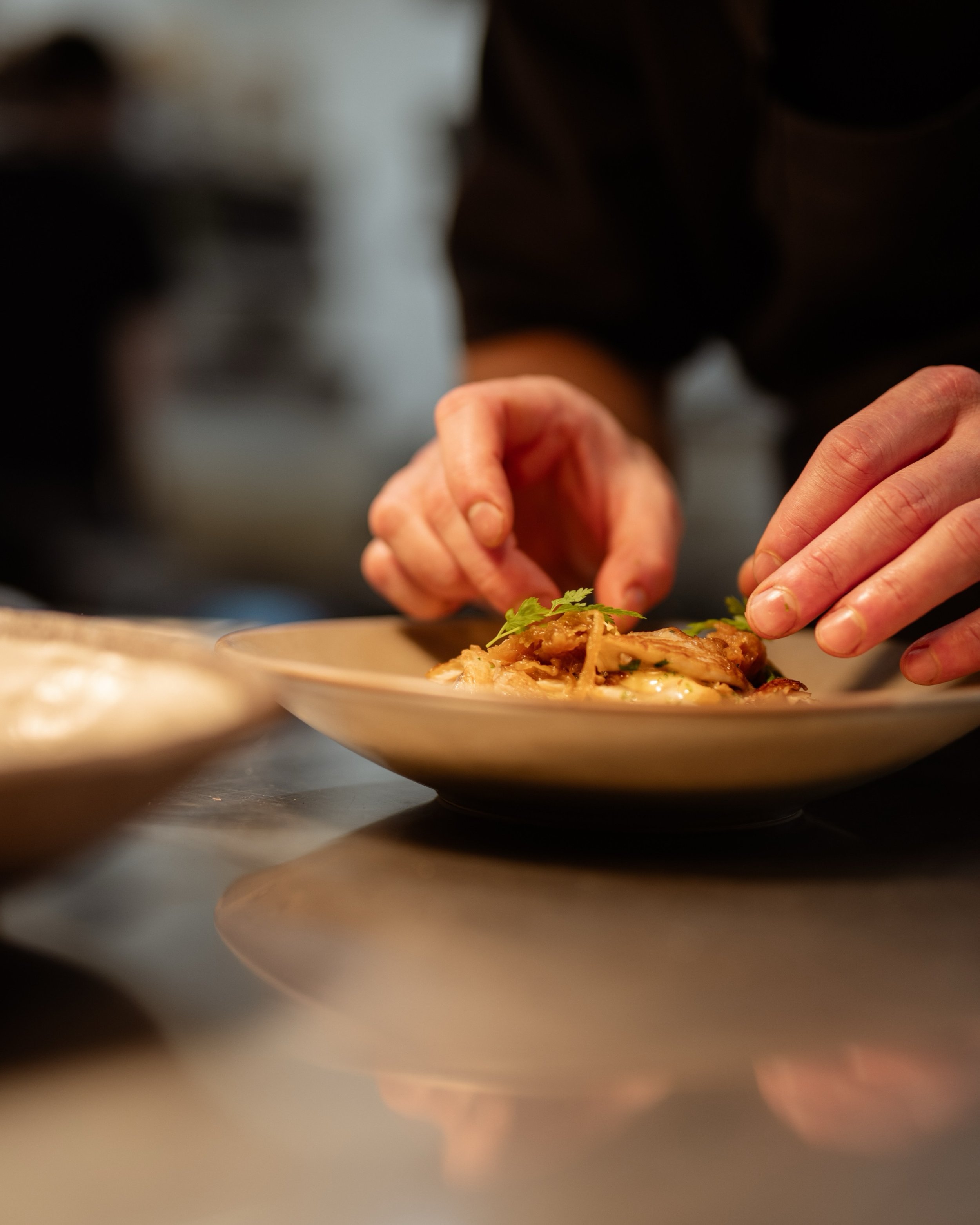 On the pass, a dish finds its final touch before it goes out.

Tomorrow marks one week since Rātā was awarded a MICHELIN Star. The kitchen hasn&rsquo;t changed pace. Same care, same hands, same attention to the small things that don&rsquo;t show up i