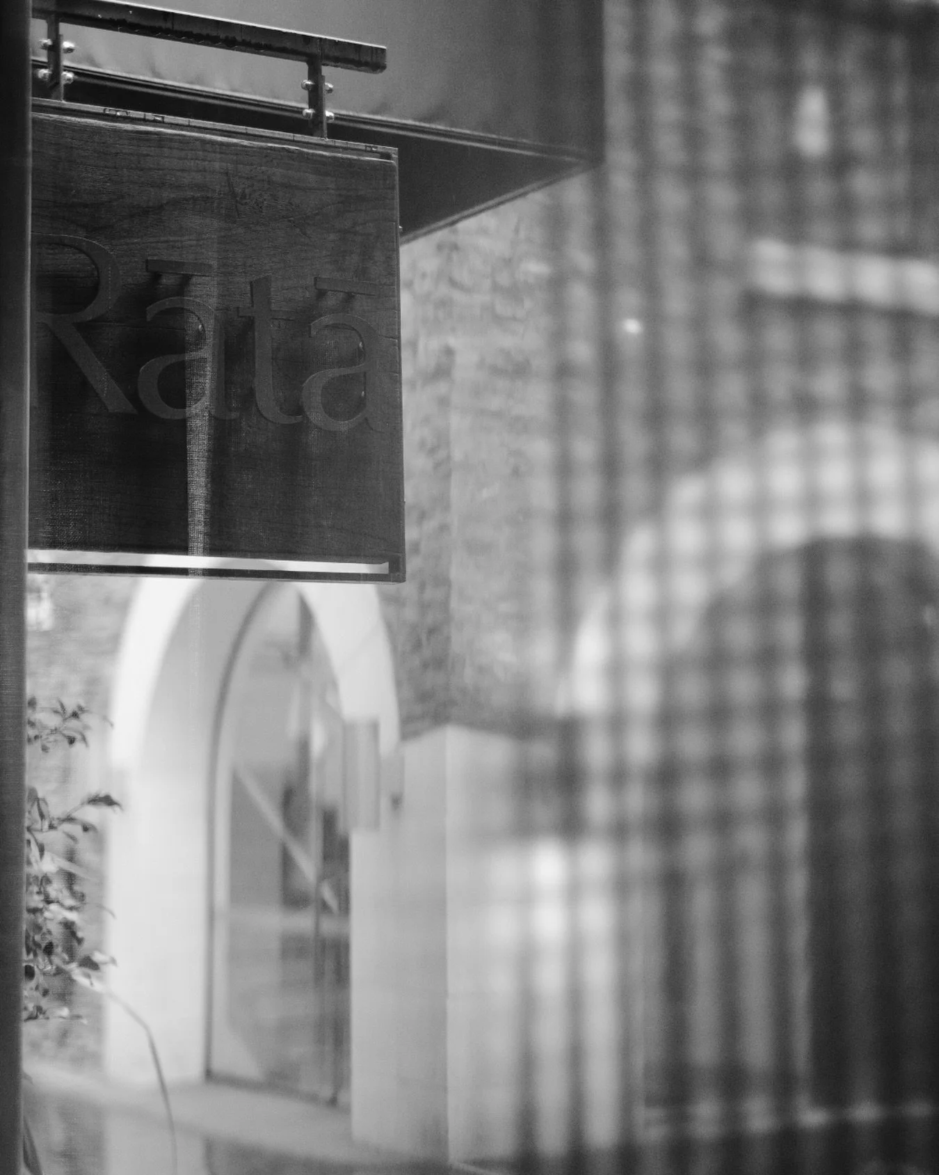 Through the glass, the room settles in for another one.