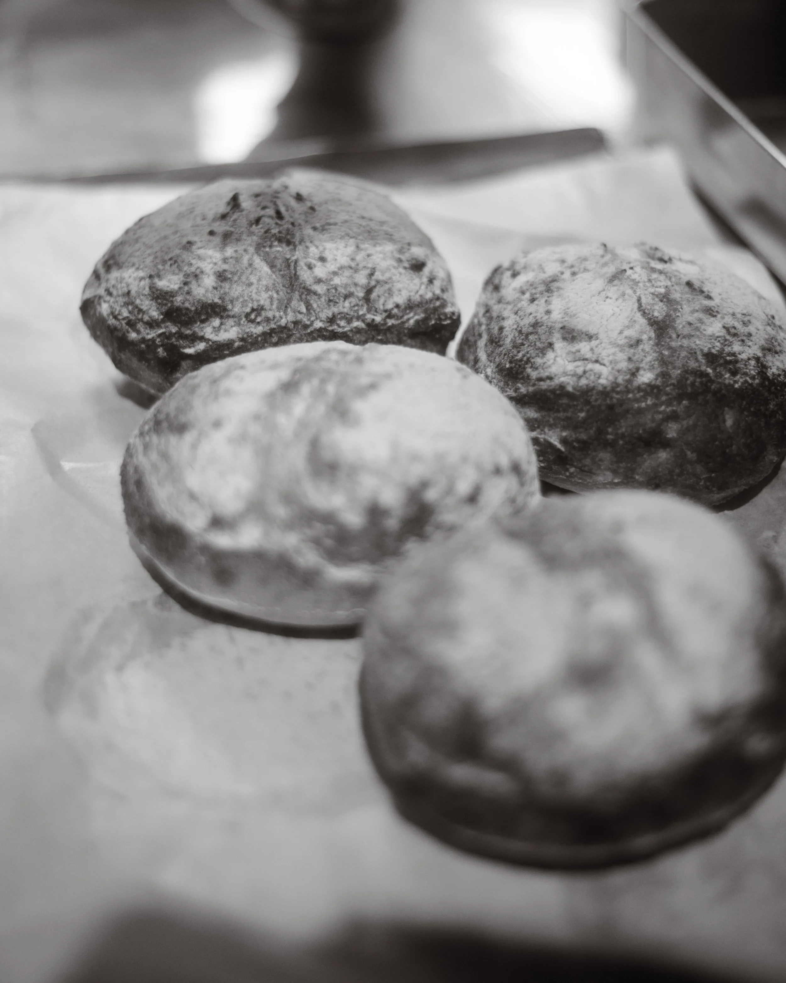 The ritual before the rush. Bread, flour, a kitchen finding its rhythm.