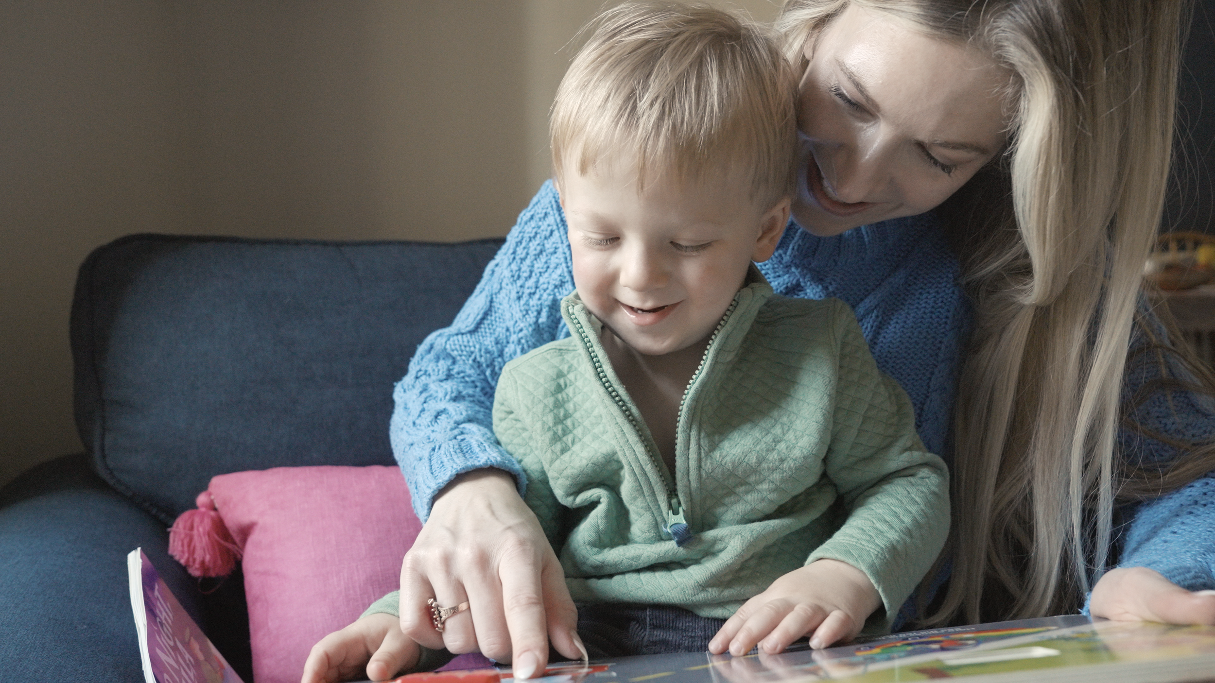 Mom cuddling her son during an in-home lifestyle family film — authentic motherhood story captured by Tara O’Brien Family Films in Kentucky.